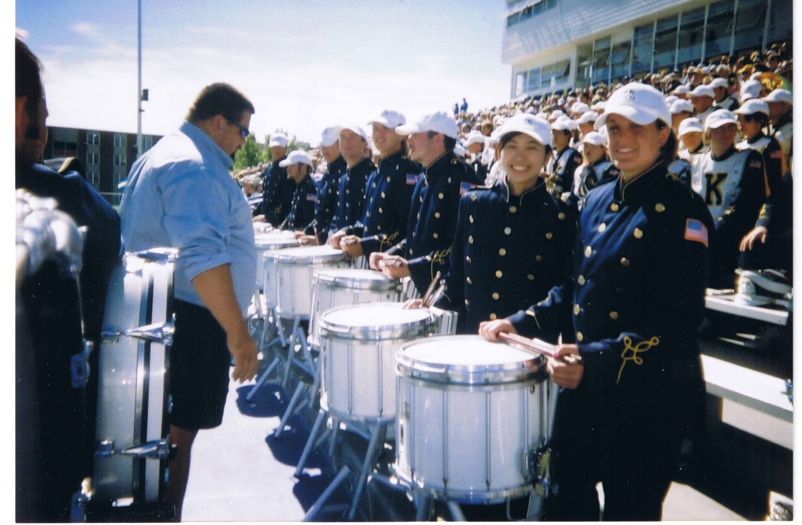 Kris with the UNK drumline in the stadium stands